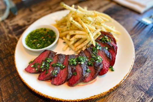 Bar Colette signature dishes Steak Frites, Mussels, Cheese and Charcuterie Boards, seasonal small plates, expertly crafted cocktails.